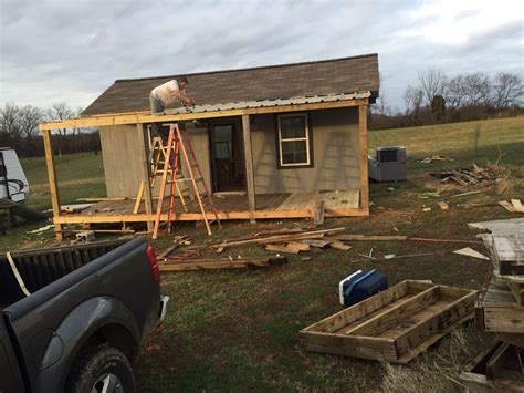 Front porch almost complete! My husband installing reclaimed tin for the roof | She sheds, House ...