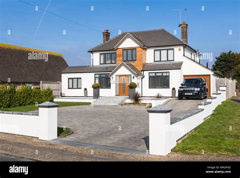 Large modern new detached house in a town in West Sussex, England, UK Stock Photo - Alamy