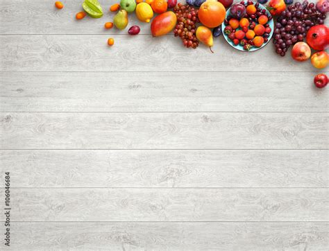 Healthy food background. Studio photo of different fruits on white wooden table. High resolution ...