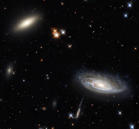 Hubble Captures Two Gargantuan Galaxies in the Perseus Galaxy Cluster