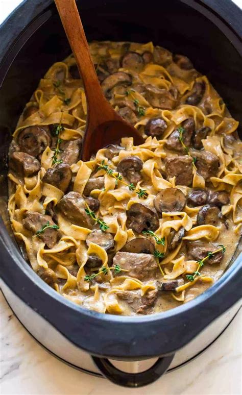 BEST Slow Cooker Beef Stroganoff. This healthy crock pot dinner is easy, creamy, and made ...