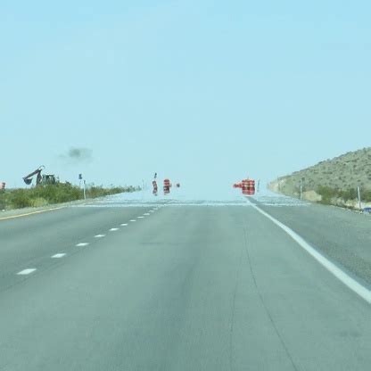 Heat Wave Water Mirage Illusion On Highway Road Nevada Desert Stock Photo - Download Image Now ...