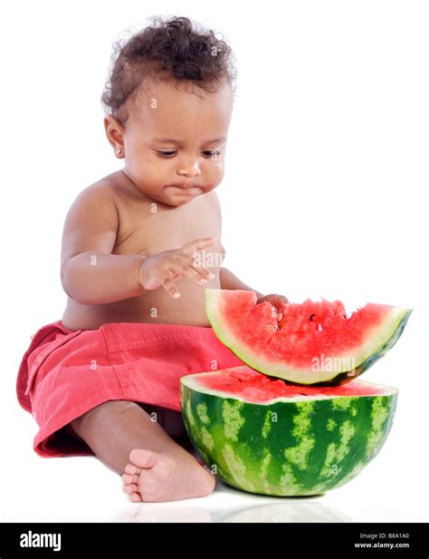 adorable baby eating watermelon a over white background Stock Photo - Alamy