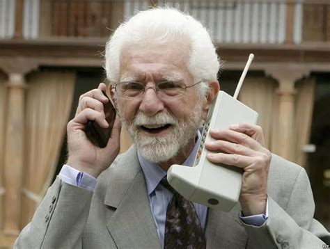 Martin Cooper, the inventor of the first mobile phone (right), multi-tasking with a smartphone ...