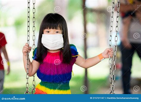 Cute Girl Wear White Medical Face Mask To Prevent the Spread of Coronavirus COVID-19. Little ...