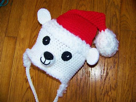 Baby Christmas Hat Polar Bear Santa Hat Newborn and Up You Pick the Size. $30.00, via Etsy.