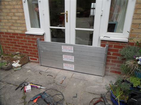 A flood barrier installation to a set of French doors. Flood barriers dont just have to go on ...