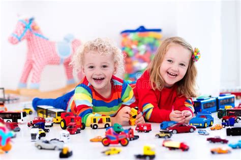 Little Kids Playing with Toy Cars Stock Image - Image of auto, plastic: 73700005