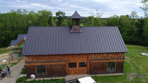 Matte black kynar aluminum metal roofing with cupola and curved panels