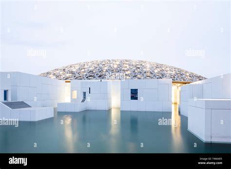 SAADIYAT ISLAND, ABU DHABI, UNITED ARAB EMIRATES - April 12, 2019: The Louvre Abu Dhabi on ...