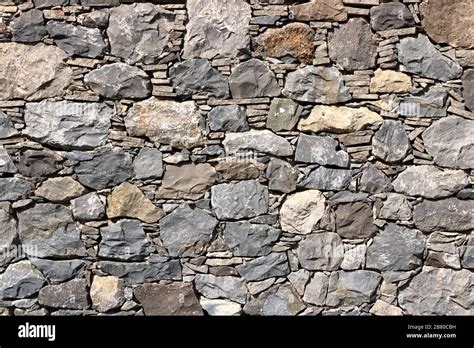 Texture of the grey granite stone wall for background Stock Photo - Alamy