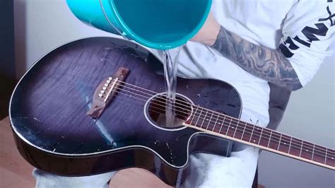 Musician Fills His Acoustic Guitar With Water to Get a Subtle Swishing Sound When He Plays