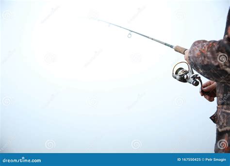 Background of Fishing Rod in the Fog with Copy Space Stock Image - Image of reel, copy: 167550425