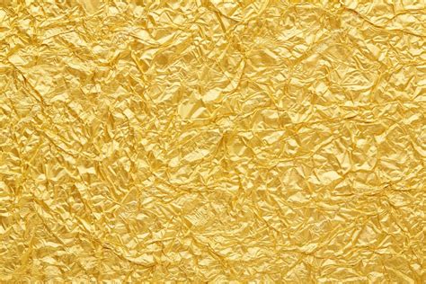 Gold foil background texture — Stock Photo © AndreaA. #24685859