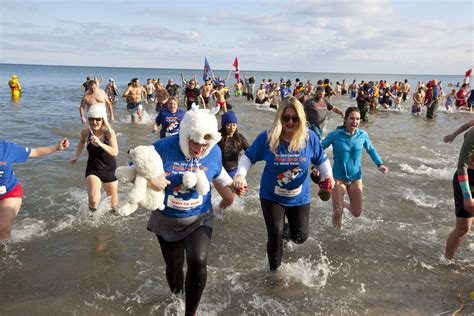 Brave Icy Cold Lake Ontario Waters During Canada’s Biggest Charity Polar Bear Dip on New Year’s Day