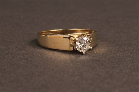 Lot 101A: One-half Carat Diamond solitaire ring, 14K gold