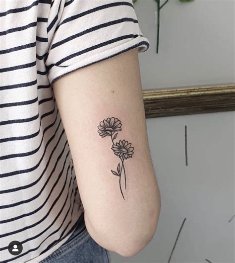 Daisy minimalist tattoo | Classy tattoos, Minimalist tattoo, Cute tattoos