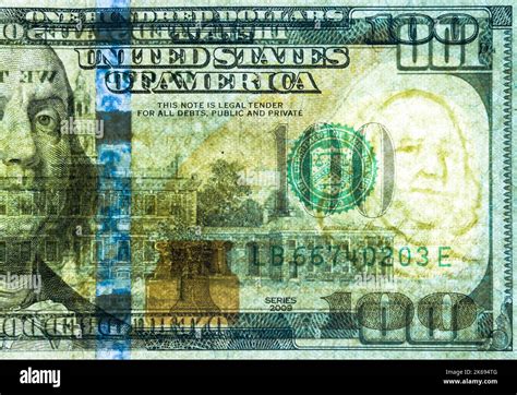 A United States of America 100 dollar bill has been backlit in order for the security watermark ...