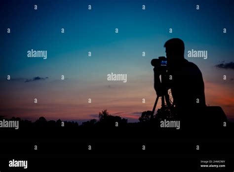 Silhouette photographer with sunset background Stock Photo - Alamy