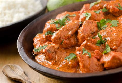 Creamy butter chicken curry with basmati rice. - Mehfil Indian