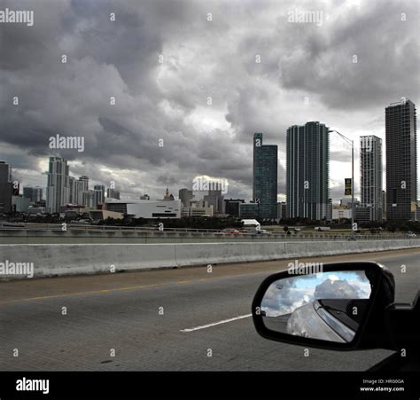 Miami cityscape skyline at dawn sunrise with dark clouds, Florida, USA Stock Photo - Alamy