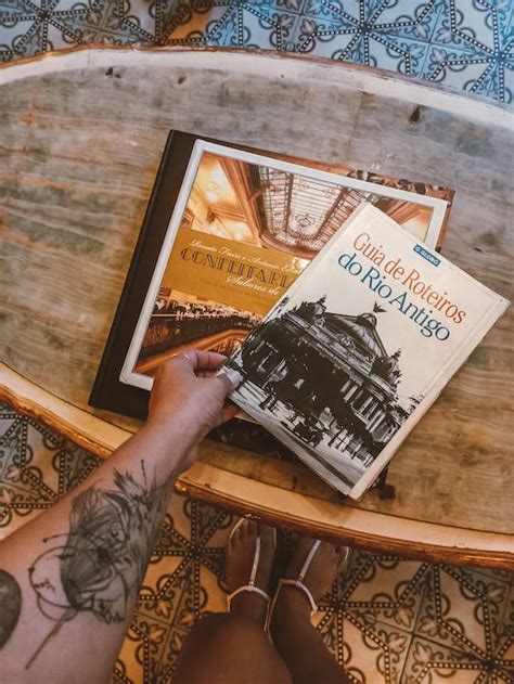 Womans Hand Holding a Book · Free Stock Photo