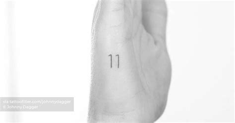 Number "11" tattoo on the hand