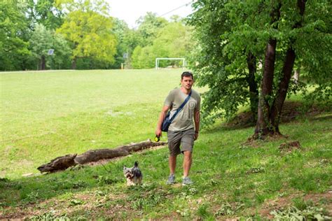 Man with Dog Enjoying in Funny Walking Stock Photo - Image of background, canine: 147917422