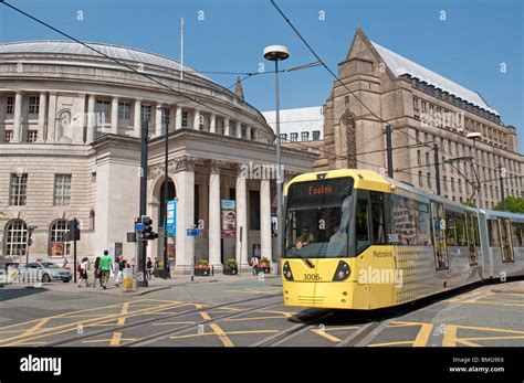 Tram in St Peter's Square,Manchester,Central Library and the Town Hall extension in the ...