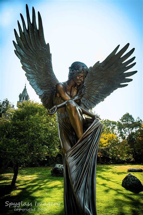 Beautiful angel statue in the entrance of a cemetery in Boston MA : pics