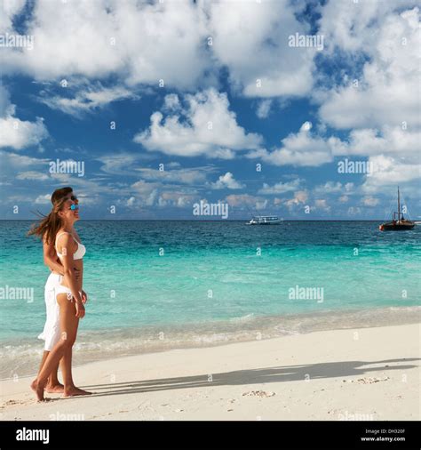 Couple on a beach at Maldives Stock Photo - Alamy