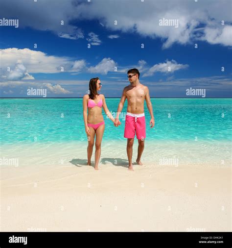 Couple on a beach at Maldives Stock Photo - Alamy