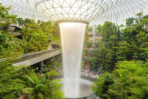 SINGAPORE - December 22, 2019: the Largest Indoor Waterfall Inside Jewel Changi Airport in ...