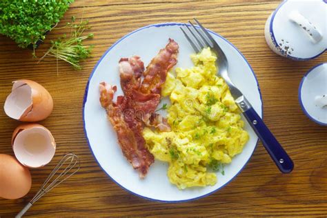 Scrambled Egg and Bacon stock image. Image of plate - 165654285