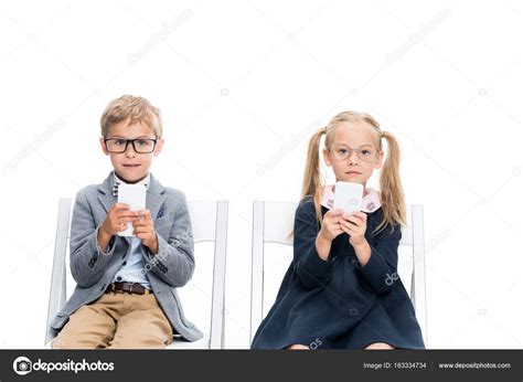 Adorable kids with smartphones — Stock Photo © IgorVetushko #163334734