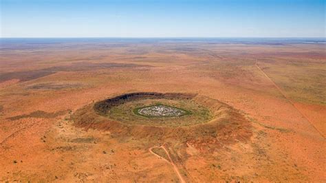 Meteorite crater discovered while drilling for gold in outback WA estimated to be 100 million ...