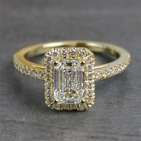 Halo Style Emerald Cut Engagement Ring In Gold