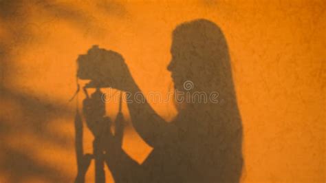 Silhouette of a Photographer at Sunset, on a Wall in Golden Colors Stock Image - Image of ...