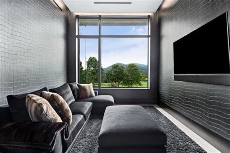 Black Modern Home Theater With Wallpaper | HGTV