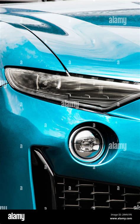 Part of a blue luxury car. Car headlights. Luxury Headlights Stock Photo - Alamy