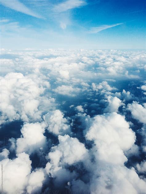 "Clouds In The Sky Seen From Airplane" by Stocksy Contributor "Simone Wave" - Stocksy