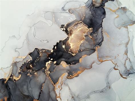 an abstract marble background with gold and black