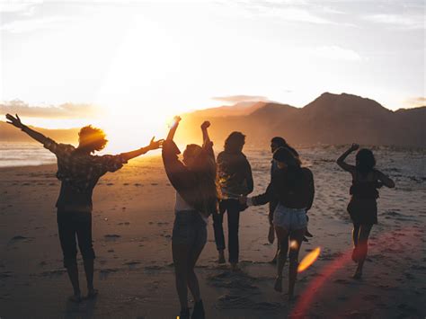 People walking on beach at sunset – free photo on Barnimages