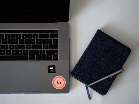 Free Sticker on Laptop Mockup (PSD)