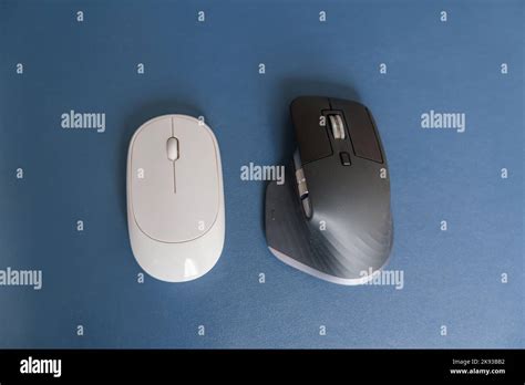 Comparison of Ergonomic vertical mouse and general mouse on desk at workplace, prevention wrist ...