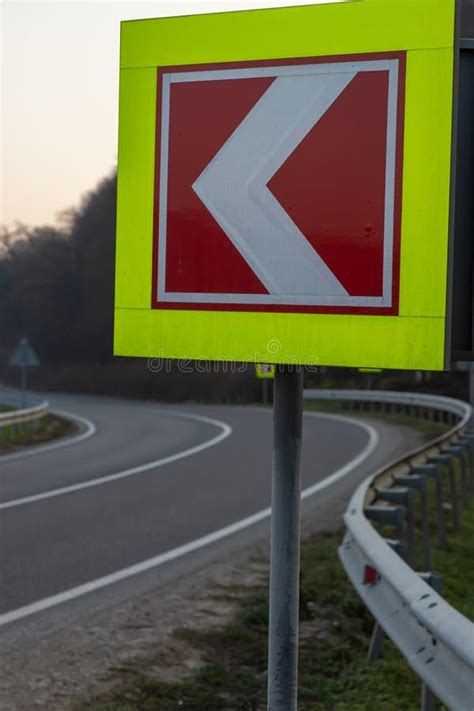 Asphalt Road with Bright Traffic Signs in Situ of the Sharp Left Turn Stock Photo - Image of ...