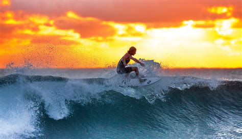 Man surfing a wave at sunset image - Free stock photo - Public Domain photo - CC0 Images