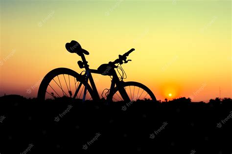 Premium Photo | Silhouette bicycle on sunset background.