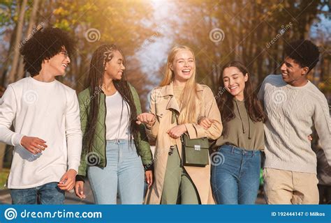 Joyful Young Friends Walking by Public Park Stock Image - Image of laughing, outdoors: 192444147