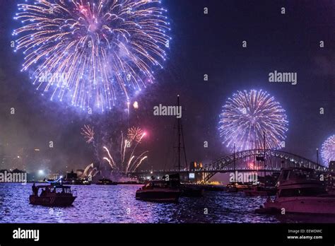 Family Fireworks Display over Sydney Opera House, Harbour Bridge and boats at anchor, New Year's ...